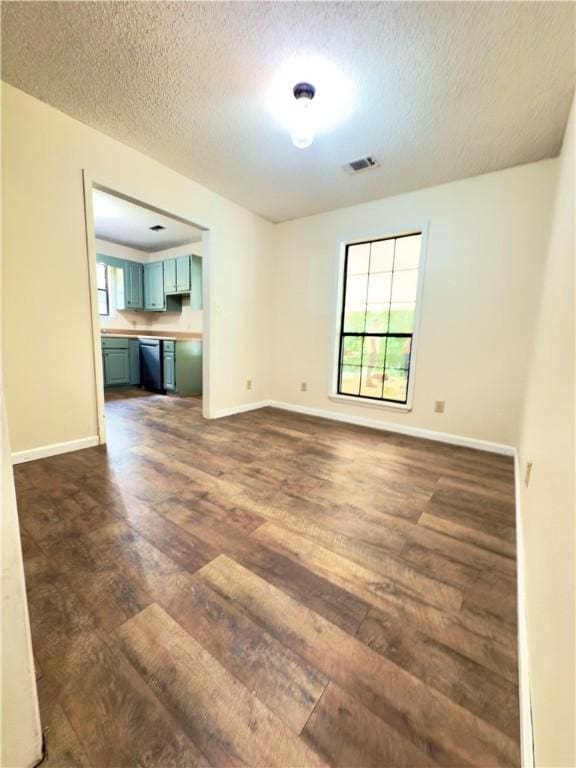 5755 Lee Road 390, Opelika, AL 36804 - empty room featuring dark wood-type flooring, a textured ceiling, and baseboards