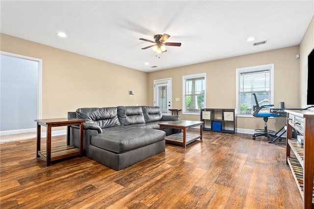 living room with wood finished floors, ceiling fan, baseboards, recessed lighting, and a desk
