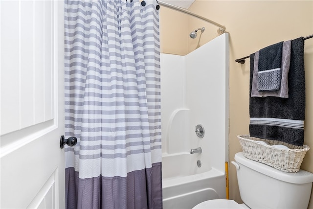 full bath featuring toilet and shower / tub combo with curtain