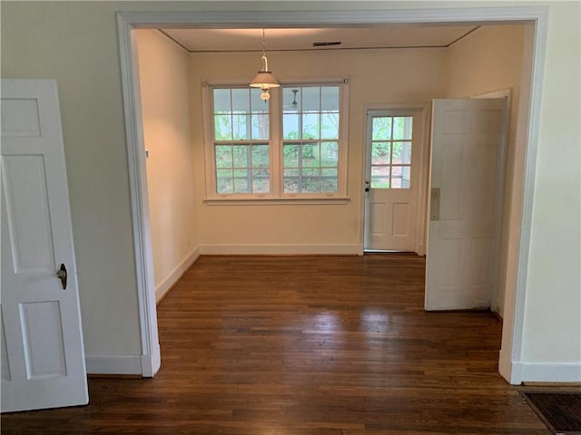 336 Payne St, Auburn, AL 36830 - unfurnished dining area featuring dark wood-style flooring, baseboards, and crown molding