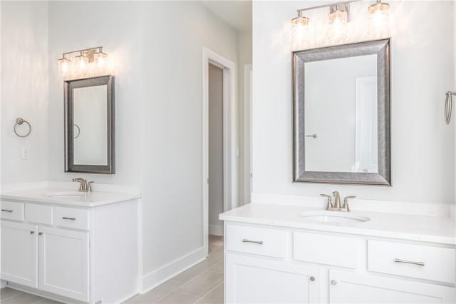 bathroom featuring tile patterned flooring and vanity