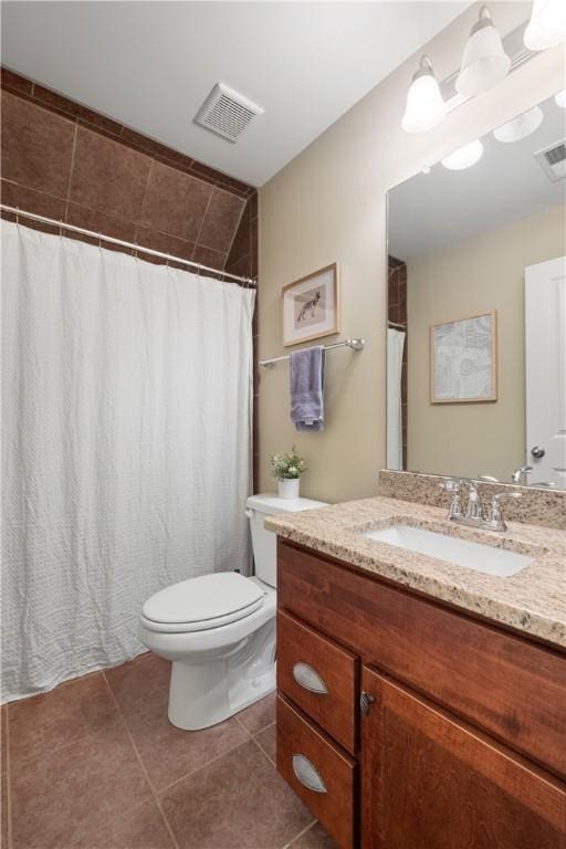 full bath with tile patterned floors, toilet, visible vents, and vanity