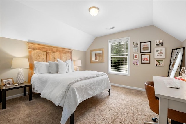 bedroom with lofted ceiling, carpet, baseboards, and visible vents