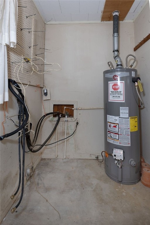 utility room featuring water heater