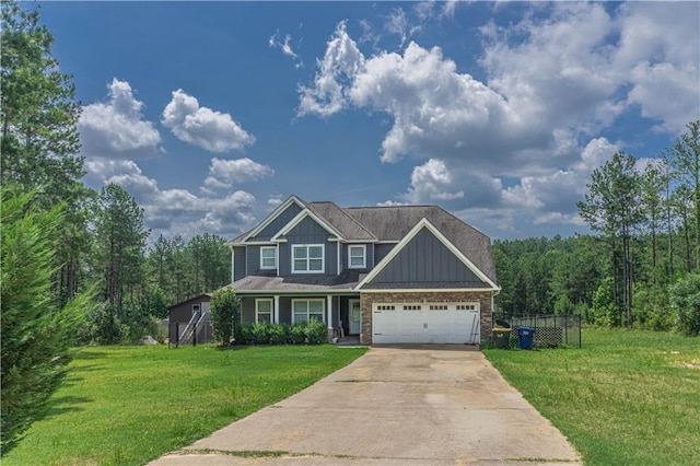 view of front of home with a garage and a front lawn