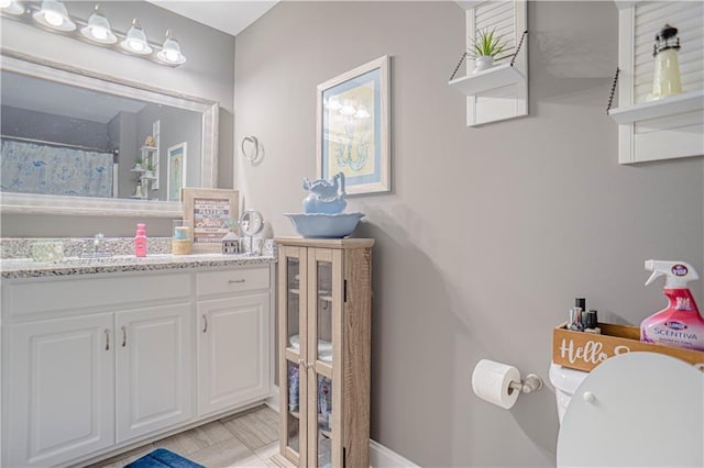 bathroom with vanity and toilet