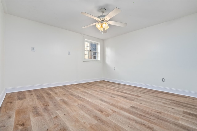 spare room featuring light hardwood / wood-style flooring and ceiling fan