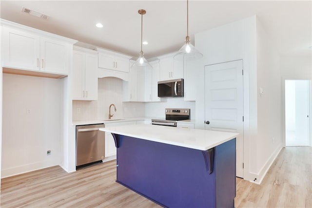 0309 Northgate Blvd, Auburn, AL 36830 - kitchen with appliances with stainless steel finishes, light wood-style floors, white cabinetry, and recessed lighting