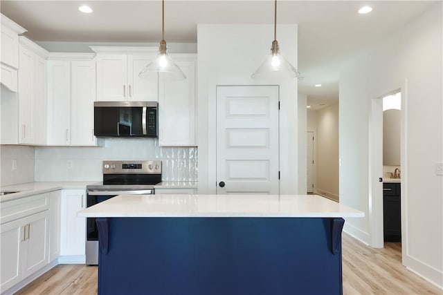0309 Northgate Blvd, Auburn, AL 36830 - kitchen with stainless steel appliances, backsplash, light countertops, light wood-type flooring, and recessed lighting