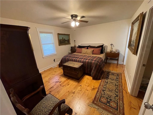 bedroom with ceiling fan and light wood-type flooring