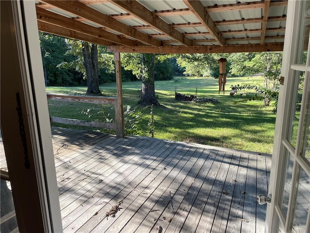 wooden terrace with a yard