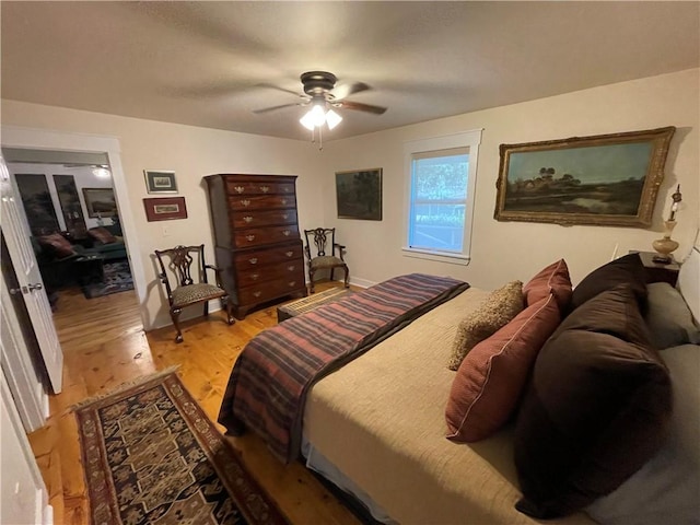 bedroom featuring ceiling fan and hardwood / wood-style floors