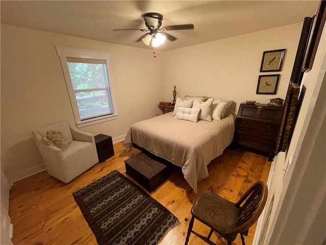 bedroom featuring ceiling fan and light wood-type flooring