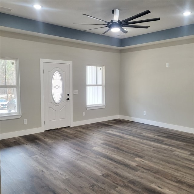 entrance foyer with ceiling fan and dark hardwood / wood-style flooring