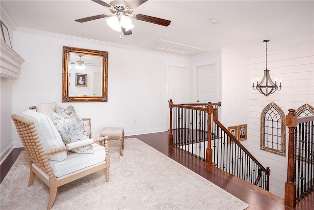2131 Preserve Dr, Auburn, AL 36879 - sitting room with an upstairs landing, wood finished floors, a ceiling fan, baseboards, and crown molding
