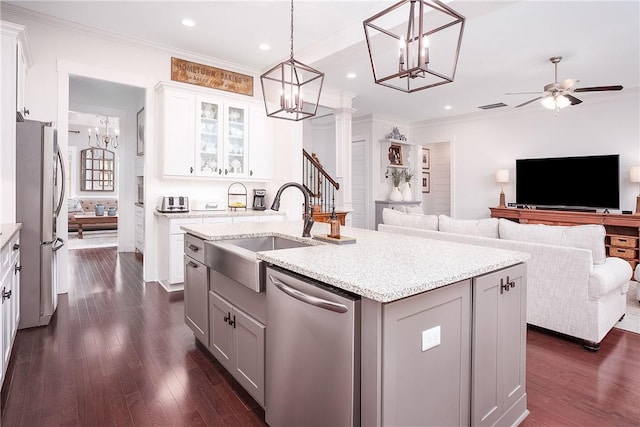 2131 Preserve Dr, Auburn, AL 36879 - kitchen with stainless steel appliances, a sink, a chandelier, open floor plan, and ornamental molding