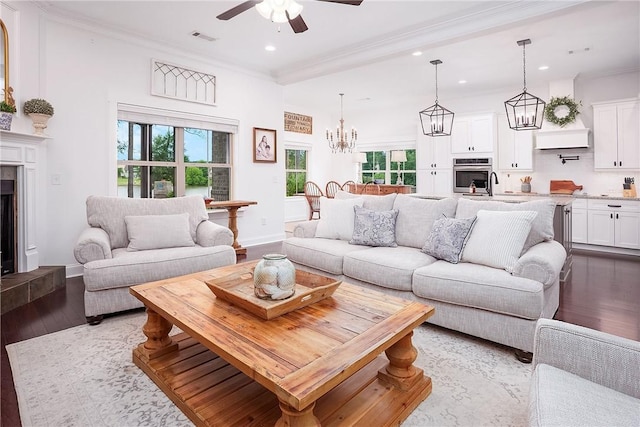2131 Preserve Dr, Auburn, AL 36879 - living room with recessed lighting, dark wood-type flooring, ceiling fan, ornamental molding, and a tile fireplace