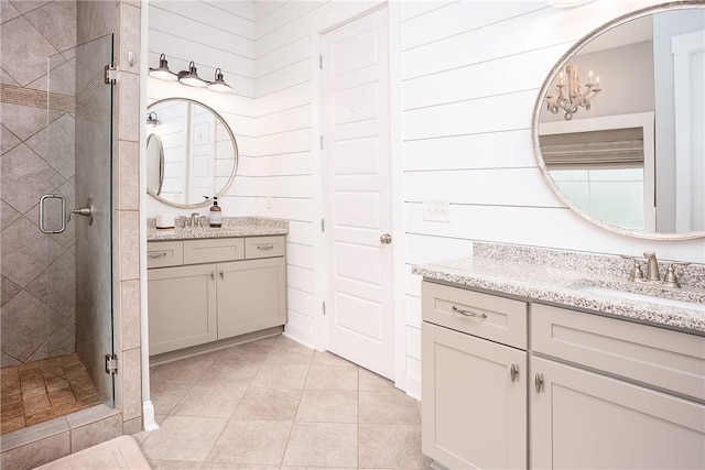 2131 Preserve Dr, Auburn, AL 36879 - bathroom featuring a stall shower, two vanities, and tile patterned floors