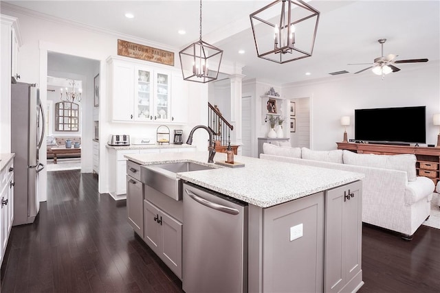 2131 Preserve Dr, Auburn, AL 36879 - kitchen with appliances with stainless steel finishes, a sink, a chandelier, open floor plan, and ornamental molding