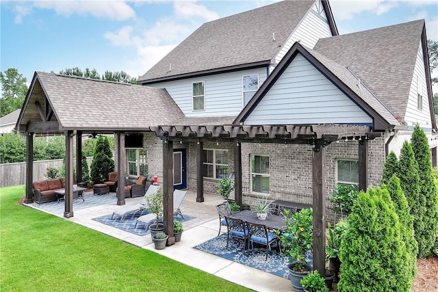 2131 Preserve Dr, Auburn, AL 36879 - back of property with an outdoor living space, a patio area, brick siding, a shingled roof, and a pergola