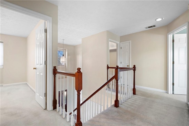 605 Lockwood St, Auburn, AL 36830 - hall featuring carpet floors, an upstairs landing, and visible vents