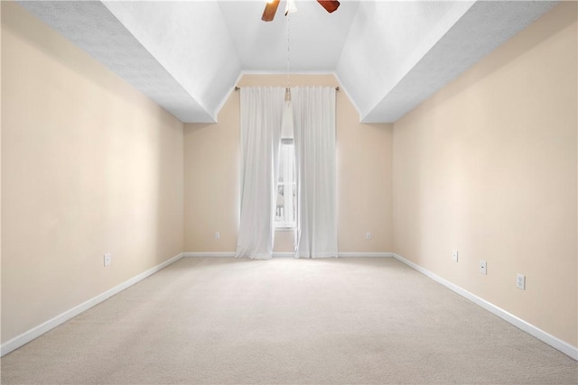 bonus room with ceiling fan, vaulted ceiling, and light carpet