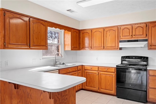 kitchen with light tile patterned flooring, black electric range, sink, and kitchen peninsula