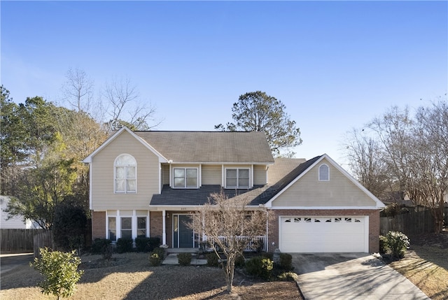 605 Lockwood St, Auburn, AL 36830 - traditional-style home featuring brick siding, fence, a garage, and driveway