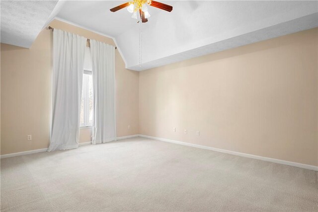 605 Lockwood St, Auburn, AL 36830 - carpeted empty room featuring baseboards, a ceiling fan, and vaulted ceiling