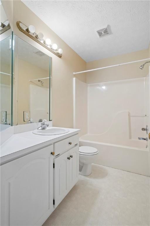 full bathroom featuring shower / bath combination, vanity, a textured ceiling, and toilet