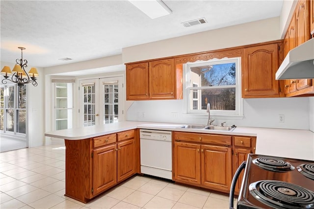 kitchen with sink, decorative light fixtures, white dishwasher, kitchen peninsula, and range with electric cooktop