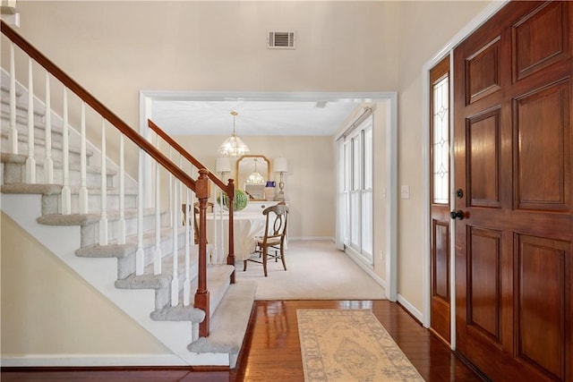 605 Lockwood St, Auburn, AL 36830 - foyer entrance featuring baseboards, dark wood finished floors, visible vents, and stairway