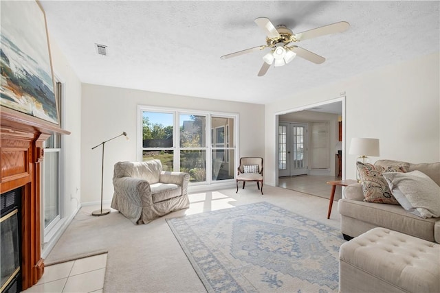 605 Lockwood St, Auburn, AL 36830 - living room with visible vents, a wealth of natural light, light carpet, and a fireplace