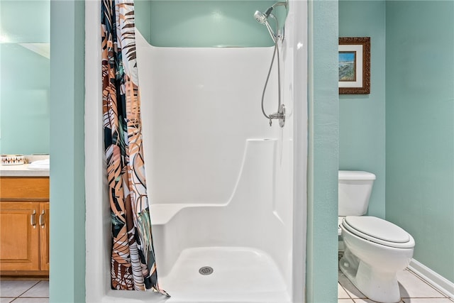 bathroom with toilet, a shower with curtain, tile patterned floors, and vanity