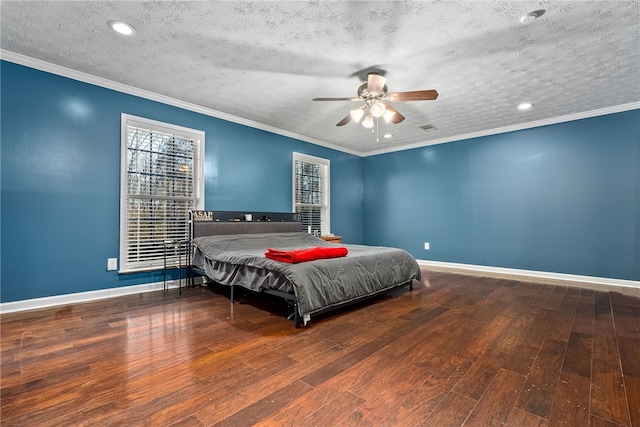 bedroom with ceiling fan, wood-type flooring, ornamental molding, and a textured ceiling