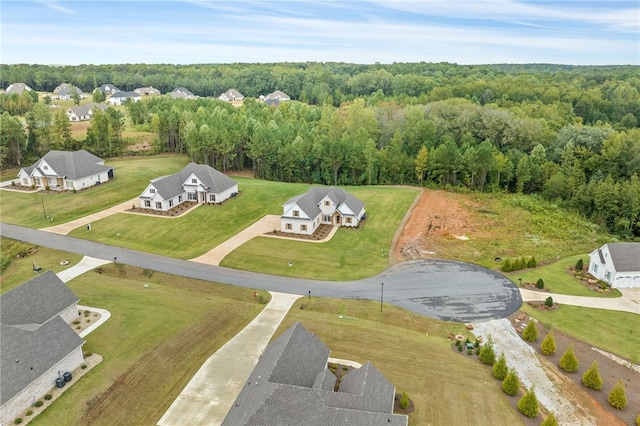 drone / aerial view featuring a view of trees