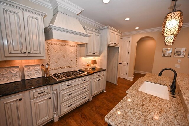 home office featuring wood-type flooring, ceiling fan, and ornamental molding