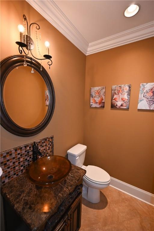 bathroom with toilet, shower / tub combo with curtain, ornamental molding, and tile patterned flooring