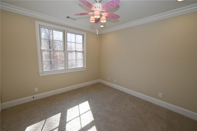 carpeted spare room featuring ceiling fan, baseboards, ornamental molding, and visible vents