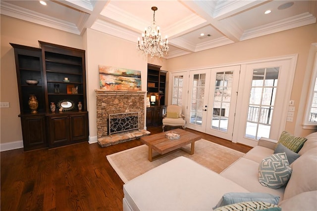 living area featuring french doors, coffered ceiling, beamed ceiling, crown molding, and dark wood-type flooring