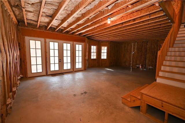 miscellaneous room with stairs and french doors