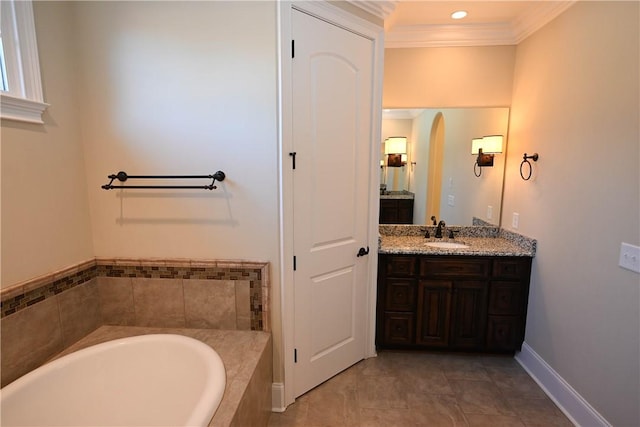 bathroom with a relaxing tiled tub, baseboards, ornamental molding, vanity, and recessed lighting