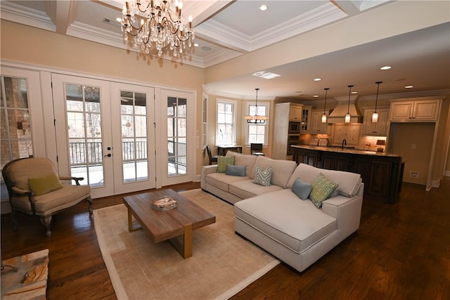 living area with french doors, crown molding, dark wood-type flooring, coffered ceiling, and beamed ceiling