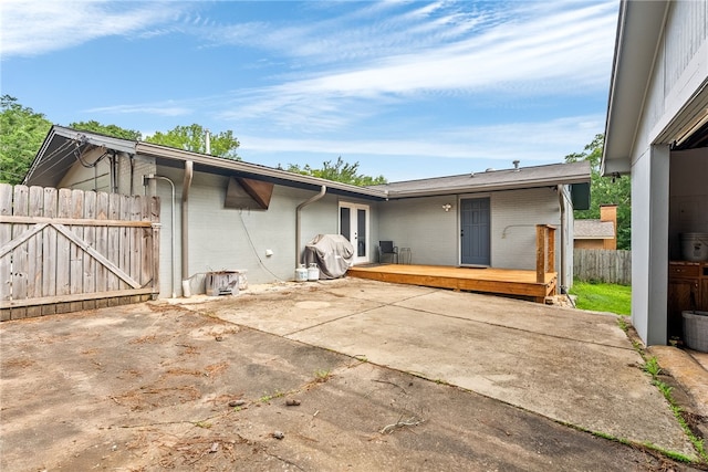 608 Edgewood Dr, Auburn, AL 36830 - back of property with a patio, a deck, french doors, and brick siding