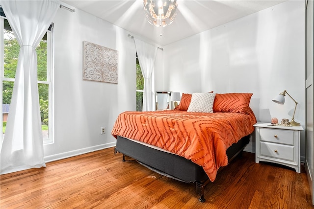 608 Edgewood Dr, Auburn, AL 36830 - bedroom featuring wood finished floors and multiple windows