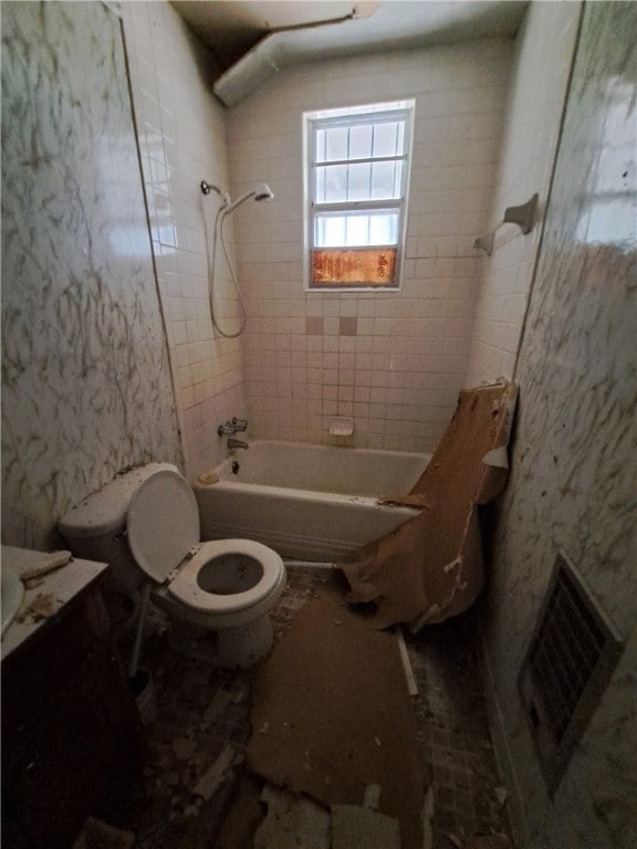 bathroom with toilet, visible vents,  shower combination, and vanity