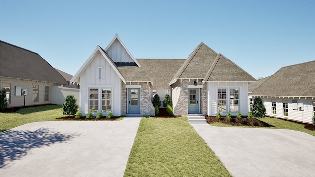 view of front of home with a front yard and french doors