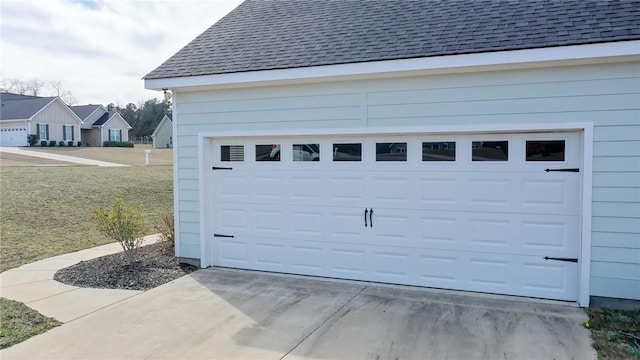 garage featuring driveway