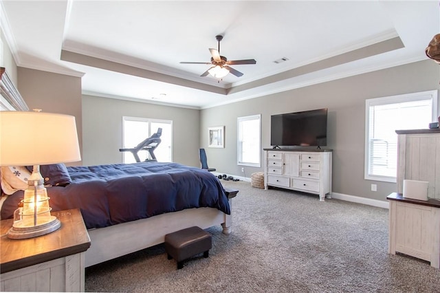 carpeted bedroom featuring crown molding, a raised ceiling, visible vents, and baseboards