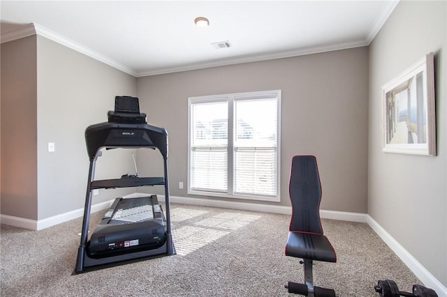 workout area featuring visible vents, crown molding, and baseboards